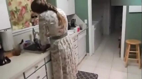 Pretty girl fucks herself with kitchen